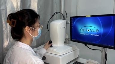 Optical Coherence Tomography Image Analysis for Therapeutic Evaluation of Ocular Surface Squamous Neoplasia 